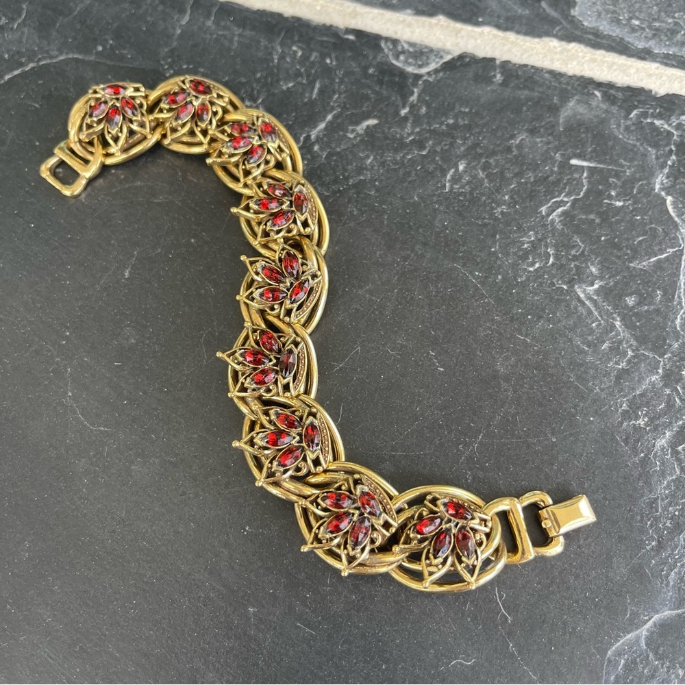 Costume Garnet colored stone bracelet with fold over clasp